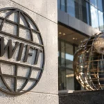 SWIFT、ブロックチェーン台帳で実取引開始｜高市首相は規制見直しを説明
